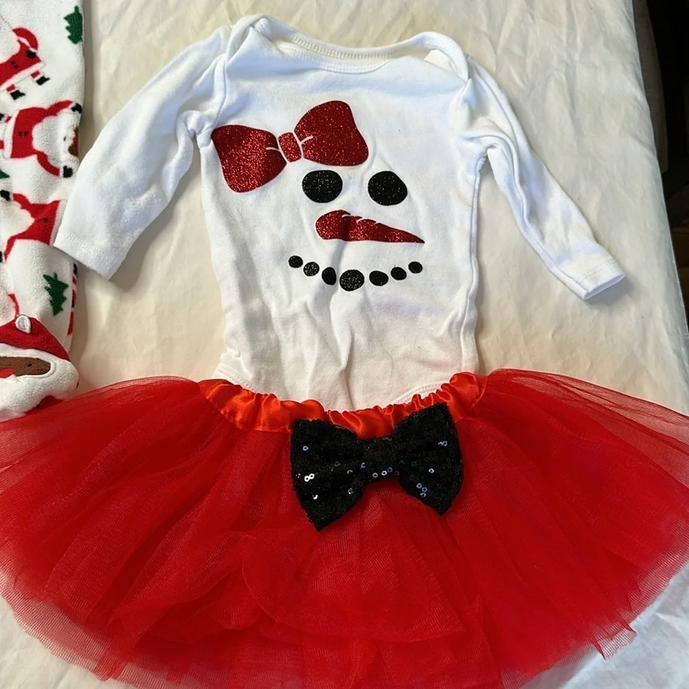 Carter’s baby girl Christmas bundle. One pair of fleece footed pajamas, one tutu